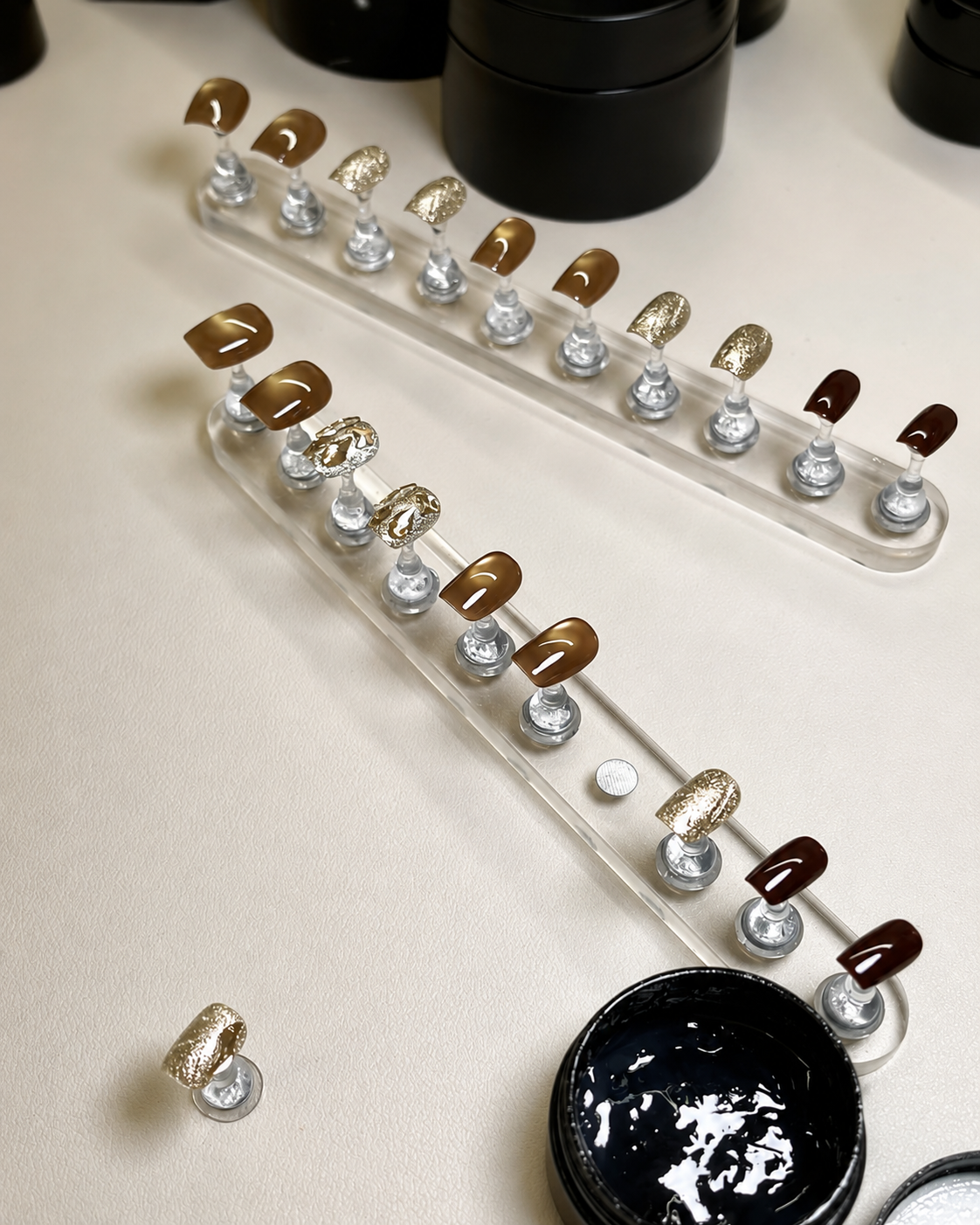 Finishing handcrafted neutral press-on nails with dimensional details