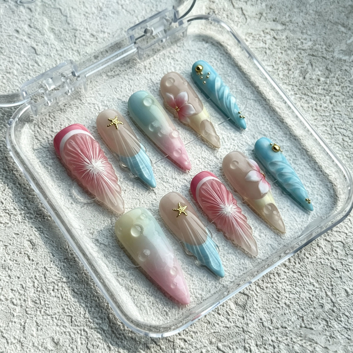 Dreamy Mirage long press-on nails with pastel watercolor, 3D swirls and gold stars