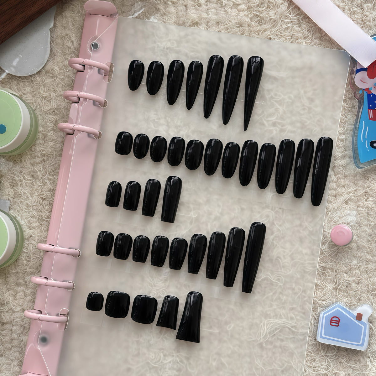Press-on nail shape samples arranged for proportion and fit